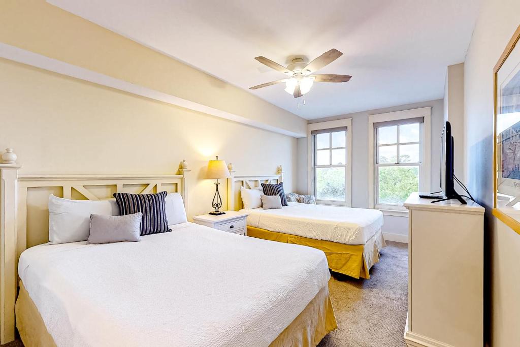 Baytowne Wharf Apartment | Bright & cozy coastal condo with shared pools hot tubs fast WiFi & central AC
