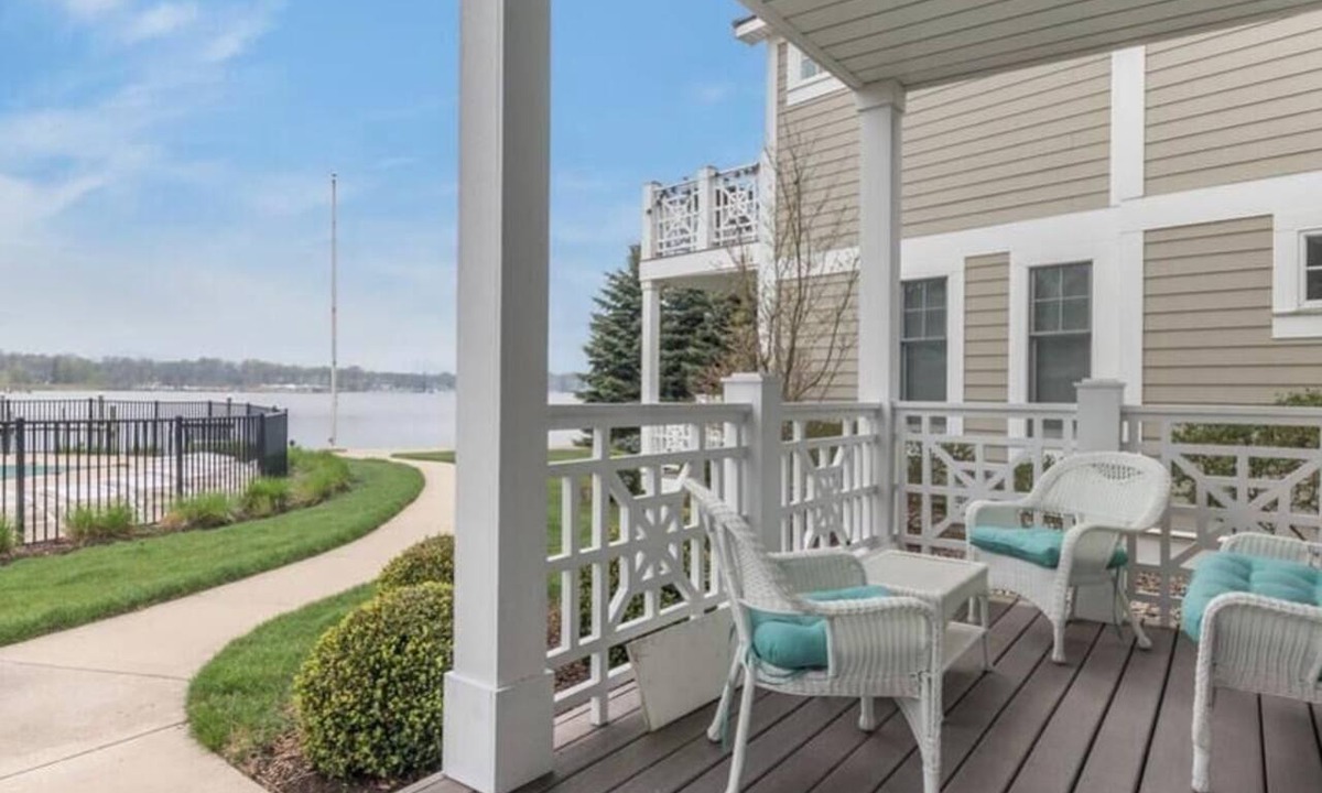 Saugatuck Condo | Discover comfort in Saugatuck at Lake Street Townhome #7, a 3BR retreat with pool views.