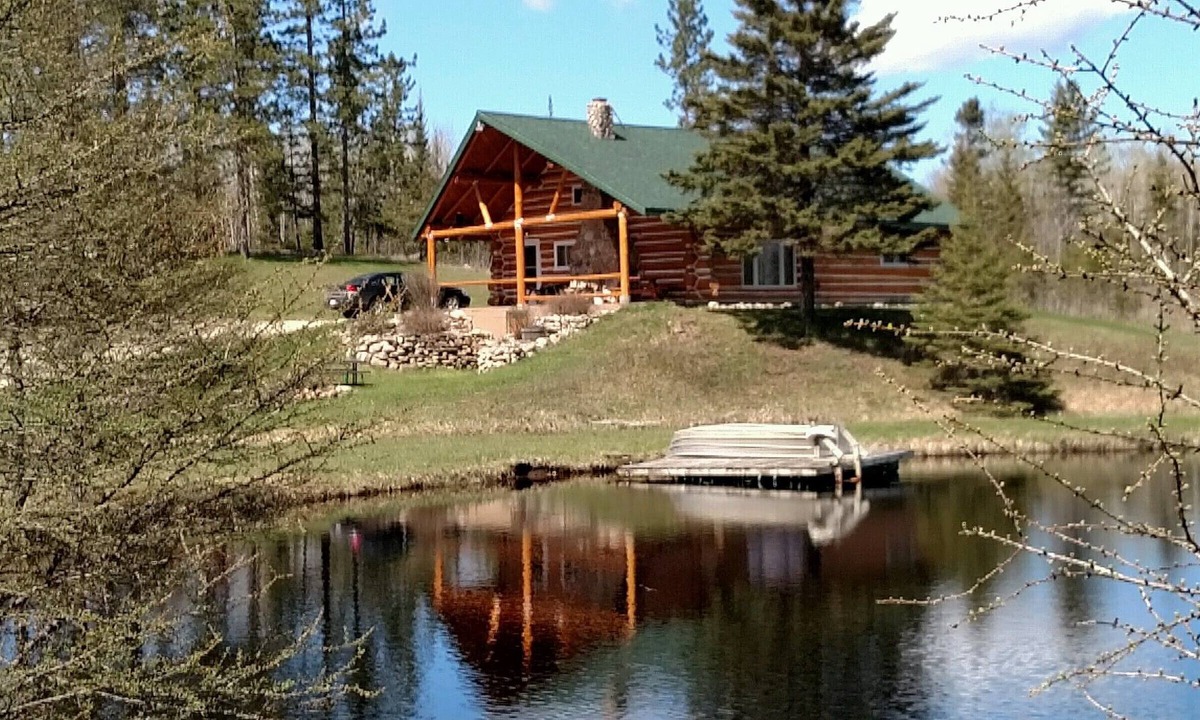 Perronville Cabin | Family friendly comfy log lodge and pond.
