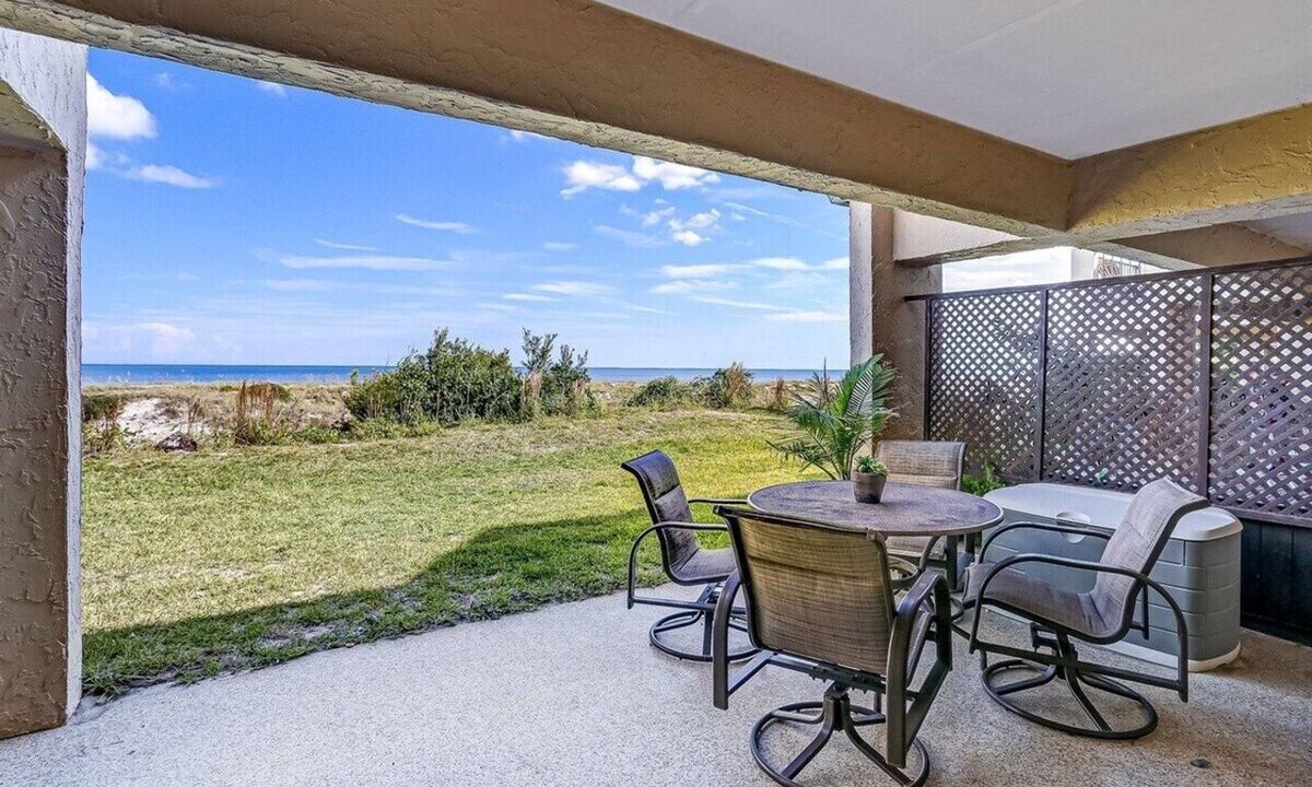 Amelia City Condo | Ground level, patio walkout - Oceanfront condo with gorgeous interior & Pool!