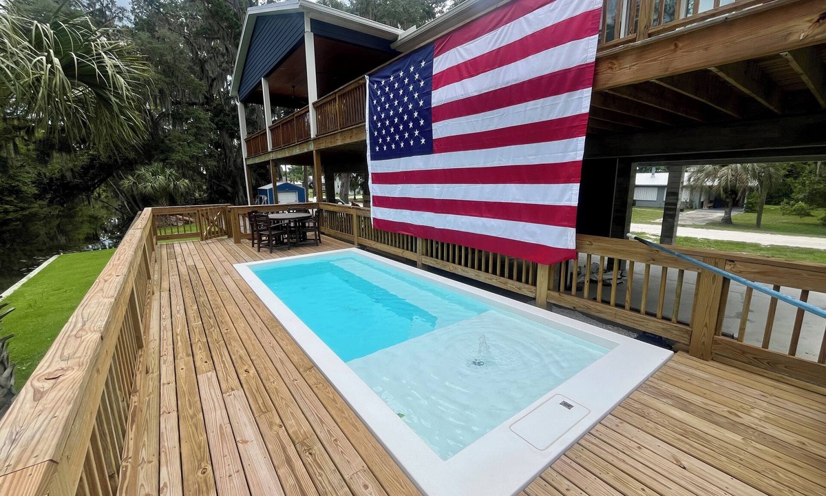 Crescent City House | Luxury Canal-Front 4BR Home, Large Patio, Dock, Springs Access, Boater Friendly
