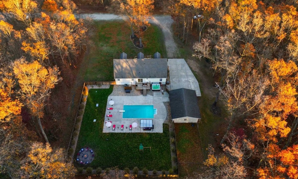 Muskegon House | Pine & Paddle Getaway Game Room Hot Tub Pool