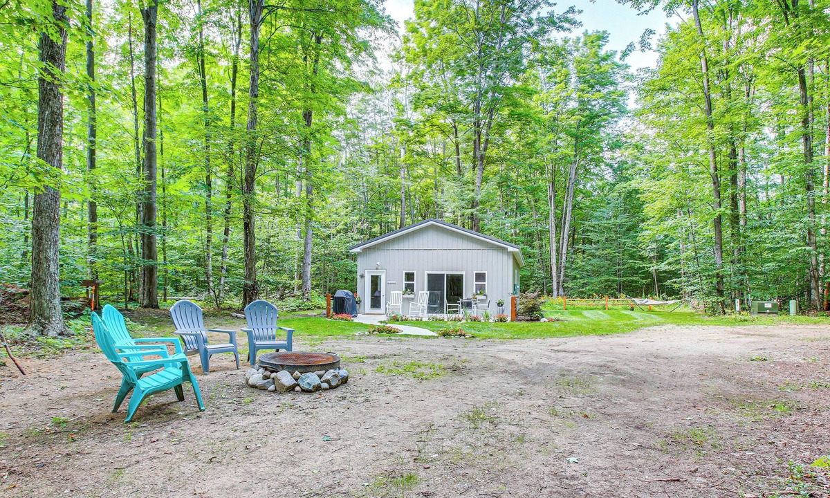 Lake Ann House | Quiet Pet Friendly Cabin w/Fire Pit near Lake Ann