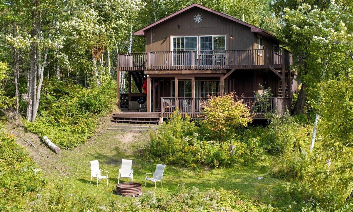 Hessel Cabin | Riverfront Cabin Incredible for Outdoor Enthusiasts with Kayaks in Hessel, Michigan