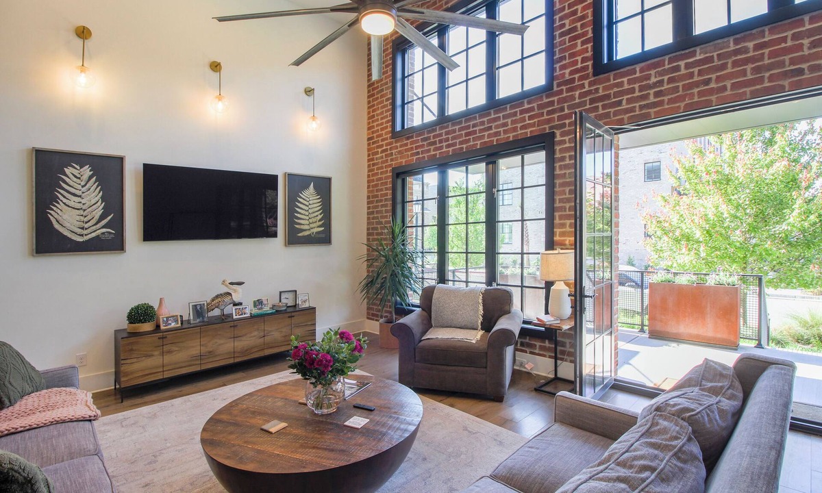 Hitch Village - Fred Wessels Homes House | Riverside Loft – Luxury Living Steps from Riverfront by Lucky Savannah