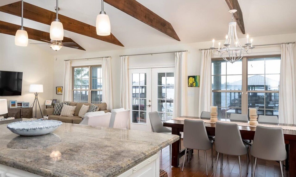 Lakeland House | Screened porch and private pier on False River