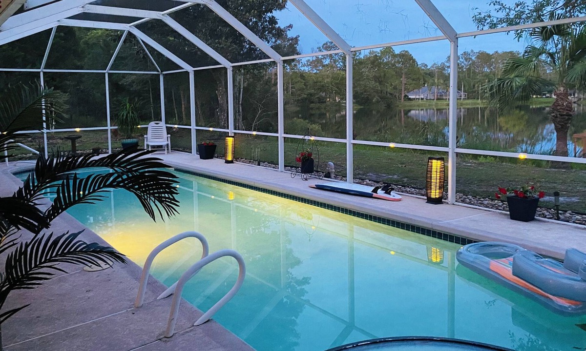 Palm Coast House | Stunning Lake house,heated pool, pet friendly, fishing spot ,restaurants ,bars