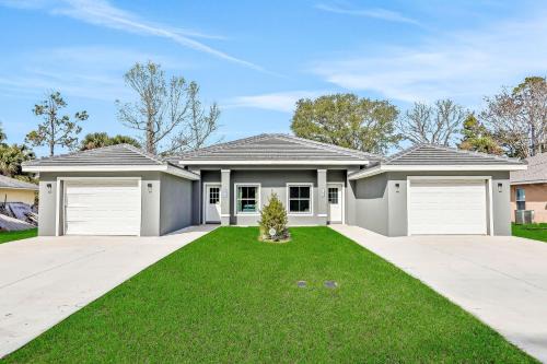 Palm Coast House | Twin villas with private pools, furnished lanais, & all-new interiors