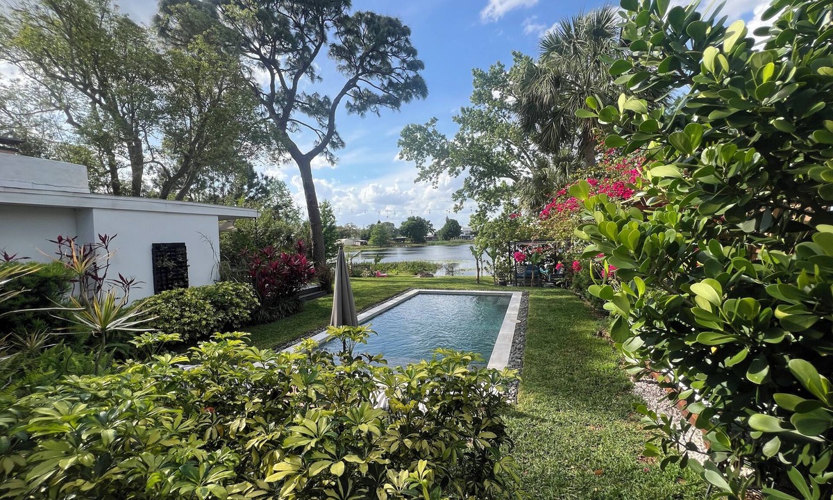 Audubon Park House | Vibrant Orlando Lakefront Cat Lover's Retreat with Pool & Gardens