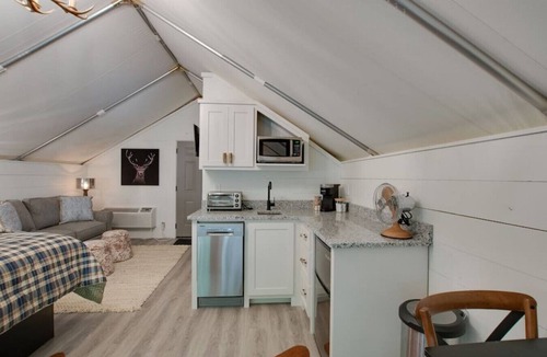 Groveoak RV Rental | #10 The Lodge Luxury Glamping Tent Hunting Theme