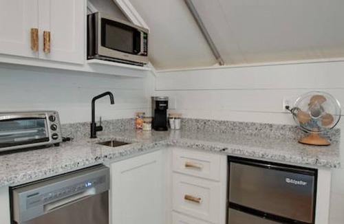 Groveoak RV Rental | #10 The Lodge Luxury Glamping Tent Hunting Theme