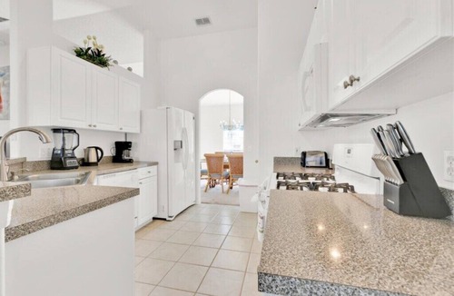 Tuscan Ridge Villa | 4BR Home with West Facing Pool and Game Room Near Disney & Shopping