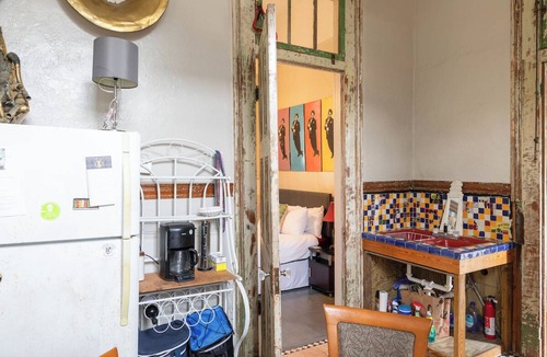 Treme Apartment | A funky-chic one-bedroom apartment with a private entrance and a full kitchen.