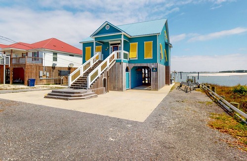 Royal Lagoons House | Bayfront home with boat slip, scenic balcony, W/D, & AC - close to beaches