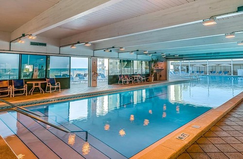 Sunnyside House | Beachfront condo in gated resort with pools lake access fast WiFi & patio