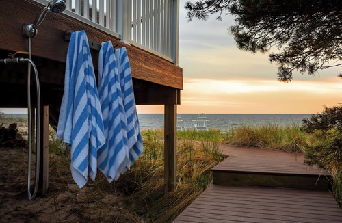 Ferrysburg Cottage | Beachfront Home on Lake Michigan. Enjoy gorgeous views and a private beach!