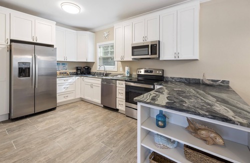 Siguenza Cove Cottage | Beautiful Fully Renovated Beach Cottage in the Purple Parrot Resort!