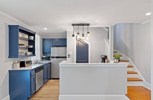 Lower Garden District Condo | Bright 1BR/2BA Garden District condo with wrap balcony, gated parking, pet-friendly, steps to Magazine
