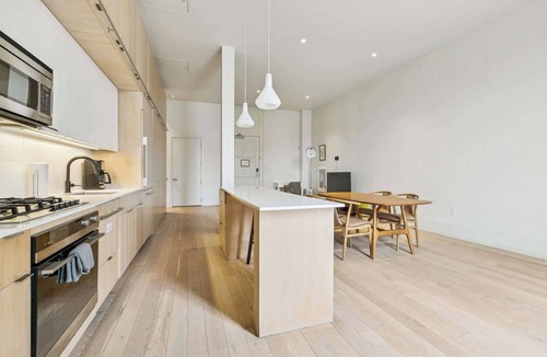 Tulane - Gravier Apartment | Chic 2BR in Historic Schoolhouse w/Private Balcony and Gated Parking