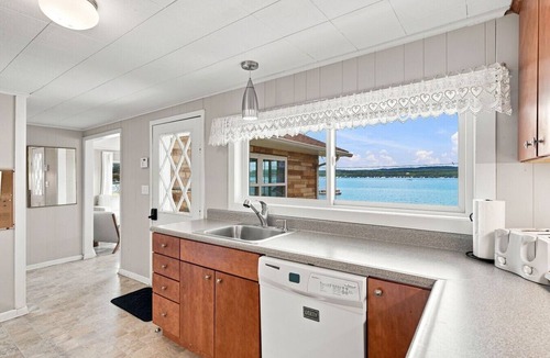 Beulah House | Classic Crystal Lake Cottage with Dock, Mooring Buoy, Fire Ring & Beach Area