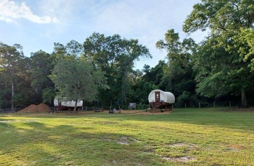 Putnam Hall Cabin | Cozy Covered Family Wagon on Rooterville’s Working Farm and Animal Sanctuary