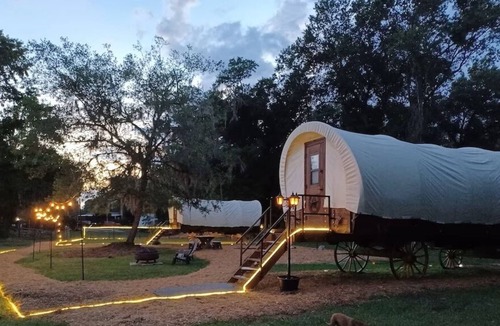 Putnam Hall Cabin | Cozy Covered Family Wagon on Rooterville’s Working Farm and Animal Sanctuary