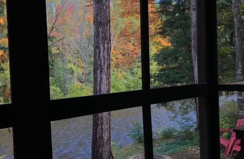 Ellis Township Cabin | Cozy river cabin, steps away from blue ribbon fishing hiking trails.