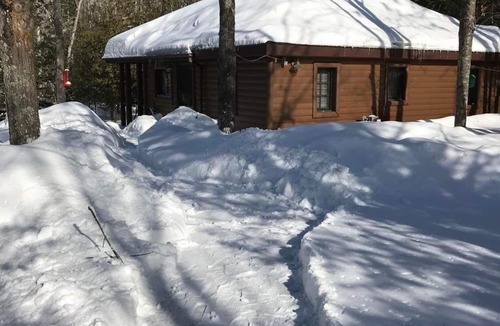 Ellis Township Cabin | Cozy river cabin, steps away from blue ribbon fishing hiking trails.