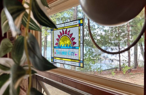 Traverse City Cottage | Cozy Traverse City Lake House: Hot Tub, Kayaks, Private Frontage & Sunset Views