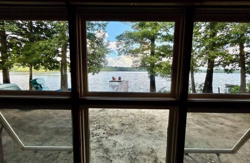 Traverse City Cottage | Cozy Traverse City Lake House: Hot Tub, Kayaks, Private Frontage & Sunset Views