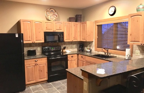 Boyne City Condo | Creekside Condo w/private hot tub at Boyne! Ski-in/Ski-out, Golf, Bike, Swim