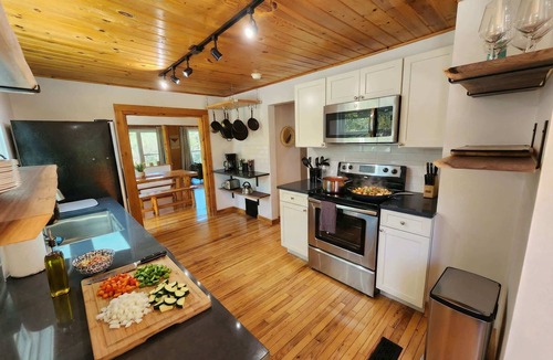 Traverse City Cottage | CreeksideHotTub WalkToBeach Uniquely Northern