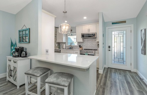 New Smyrna Beach House | Dog Friendly Home w/Private Fenced Yard, Garage & Fire Pit. STEPS to the Beach!