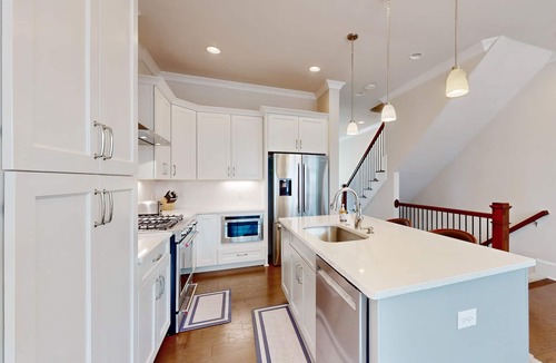 Hitch Village - Fred Wessels Homes House | Dog-friendly townhouse with modern kitchen, balcony, garden tub, & central AC
