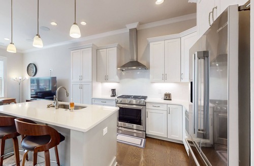 Hitch Village - Fred Wessels Homes House | Dog-friendly townhouse with modern kitchen, balcony, garden tub, & central AC