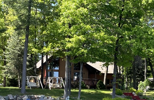 Gladwin Ski Chalet | Dream Cottage w/ Sandy Beach, Dock, Pontoon Rental