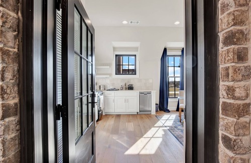 Hitch Village - Fred Wessels Homes Apartment | “ Elegant Carriage House Studio on the River”