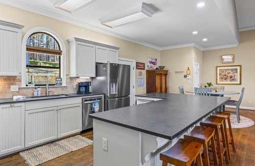 Little Kowaliga House | Escape to this stunning 6 bed, 5 bath lakefront home, perfect for large groups & family getaways. With space to sleep up to 20 guests, this home features expansive indoor living areas & breathtaking lake views throughout.