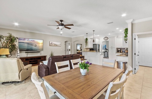 Fort Walton Beach House | Escape to your Fort Walton Beach oasis! High-end 4BR home sleeps 8 with a resort backyard: heated pool with jets, 5-star outdoor kitchen, pizza oven, theater TV, and fire pit. Near top beaches, featuring chic coastal decor and keyless check-in.