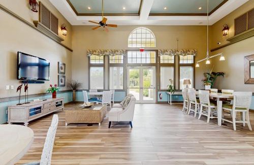 Palm Coast House | Ground floor waterview condo with resort amenities, private patio and pool