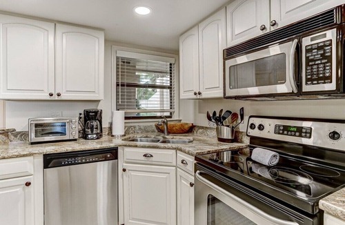 Amelia City Condo | Ground level, patio walkout - Oceanfront condo with gorgeous interior & Pool!