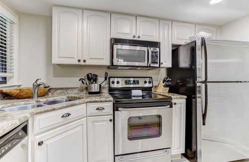 Amelia City Condo | Ground level, patio walkout - Oceanfront condo with gorgeous interior & Pool!