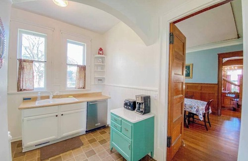 Manistee House | Historical dog-friendly home with fenced yard, grill, Ping-Pong, fireplace, & AC
