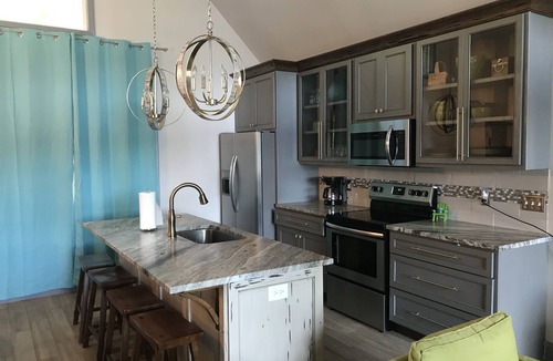 Jacksons' Gap House | Lake Martin home, lakefront, renovated house, no stairs- beach area