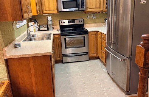 Fackler Apartment | Lake side apartment with shared 100’ pier and pavilion with rock BBQ pit.