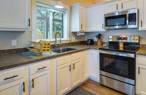 Kalkaska House | Lakefront cottage on Crawford Lake with 2 kayaks, private dock, and outdoor seating. Large driveway for ATV trailers with direct trail access. Near golf courses, other lakes, and just 35 minutes to Traverse City. The perfect summer escape! 🌊☀️