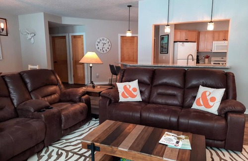 Bellaire Condo | LOCATION LOCATION! Golfers Paradise & ski in/out on the 18th green Cedar River