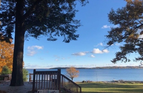 Suttons Bay House | Lodge-style home in Suttons Bay. Main house & caboose. Central A/C. Dog ok.