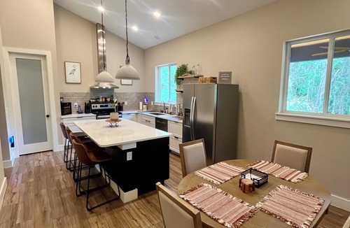 Crescent City House | Luxury Canal-Front 4BR Home, Large Patio, Dock, Springs Access, Boater Friendly