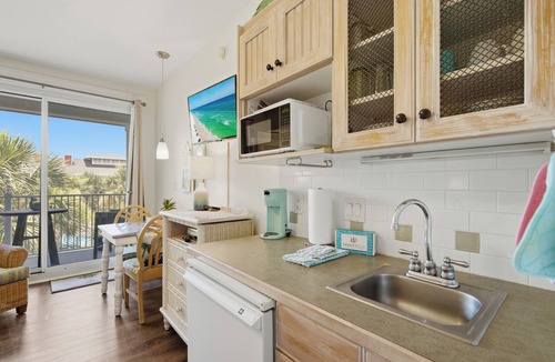 Baytowne Wharf Condo | New! Studio with Covered Balcony, Tropical Pool Views, Hot Tub, Tram